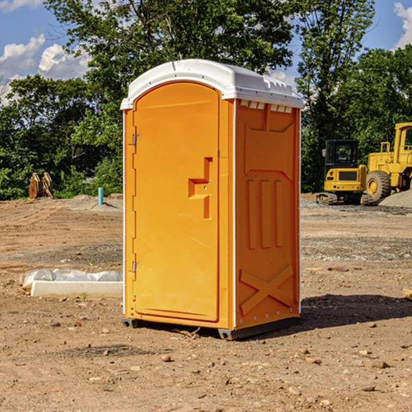 what is the cost difference between standard and deluxe portable restroom rentals in Hesston